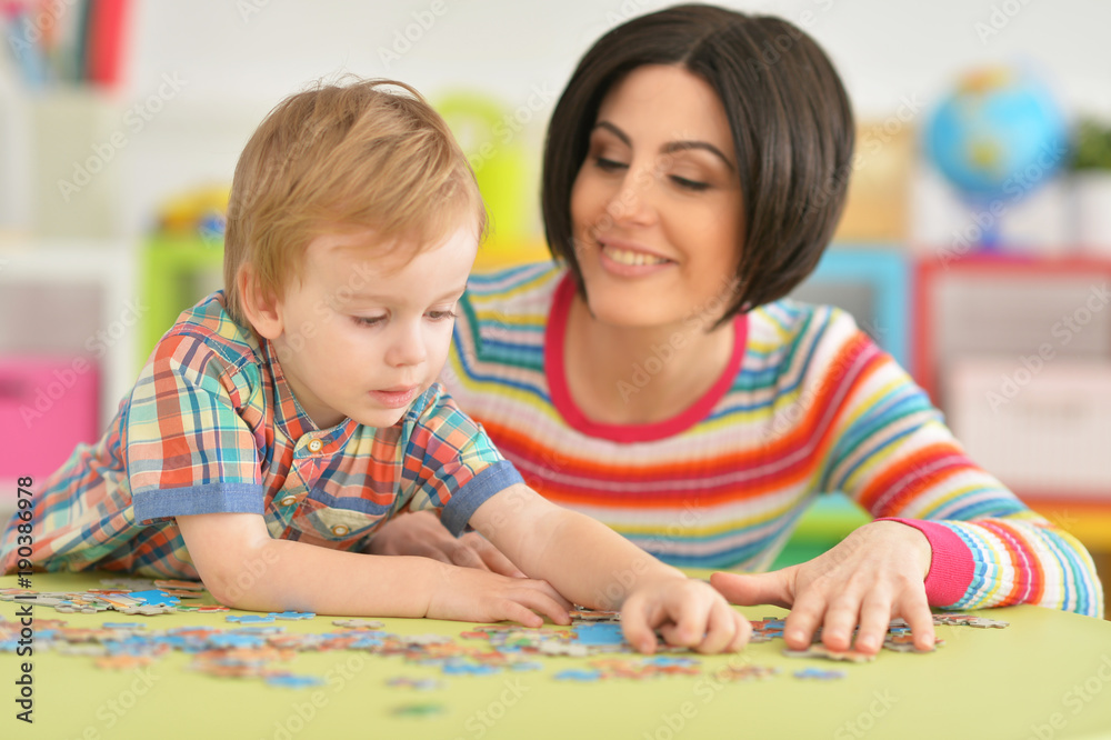 Young mother playing with son Young mother playing with son