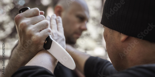 Lameco Astig Combatives instructor demonstrates knife attack disarming technique