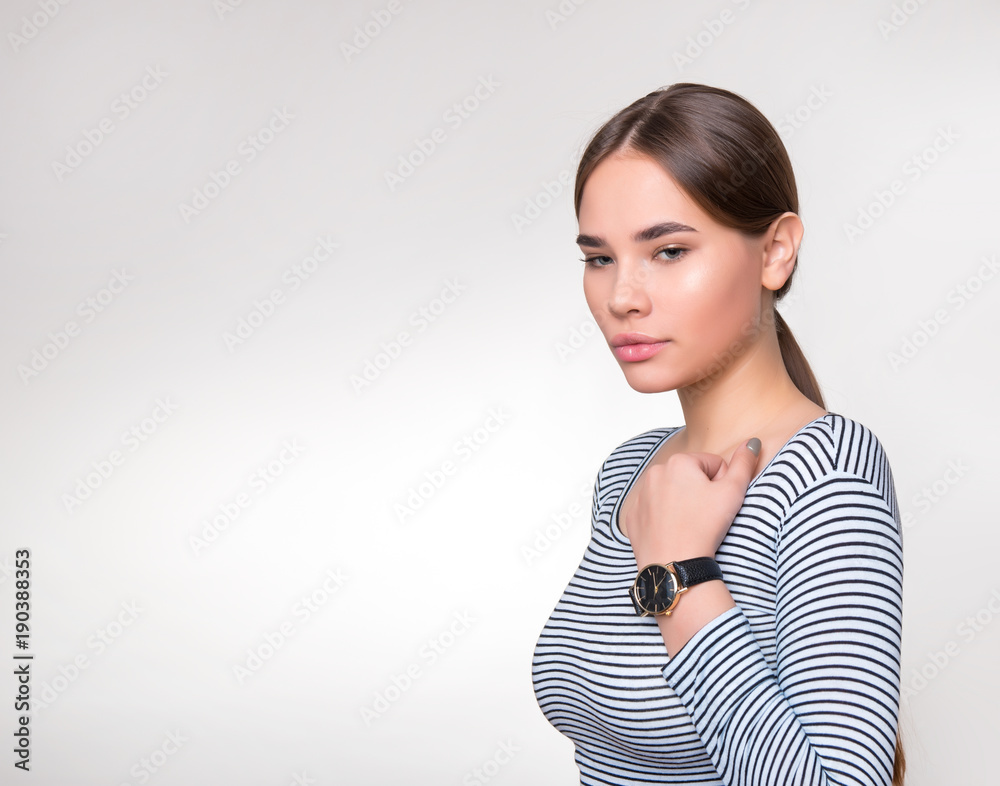 beautiful young woman with long hair wearing wrist watch beautiful young woman with long hair wearing wrist watch