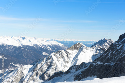 Landscape of mountains in winter with blue sky