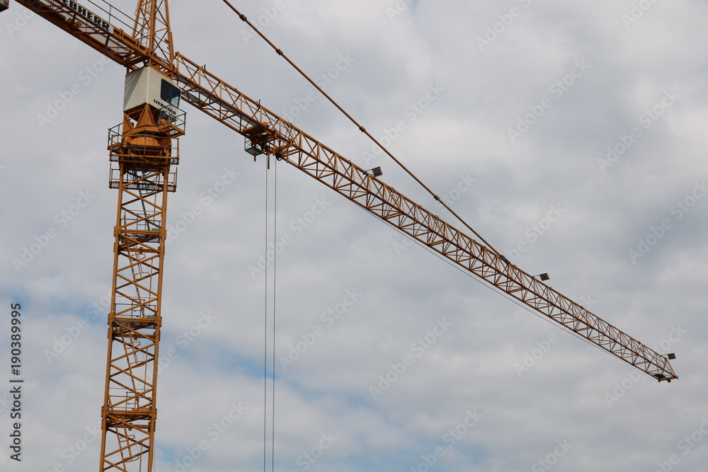 Big crane and cloudy sky in background 