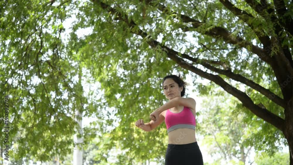 Beautiful asian slim woman exercise at the park Beautiful asian slim woman exercise at the park