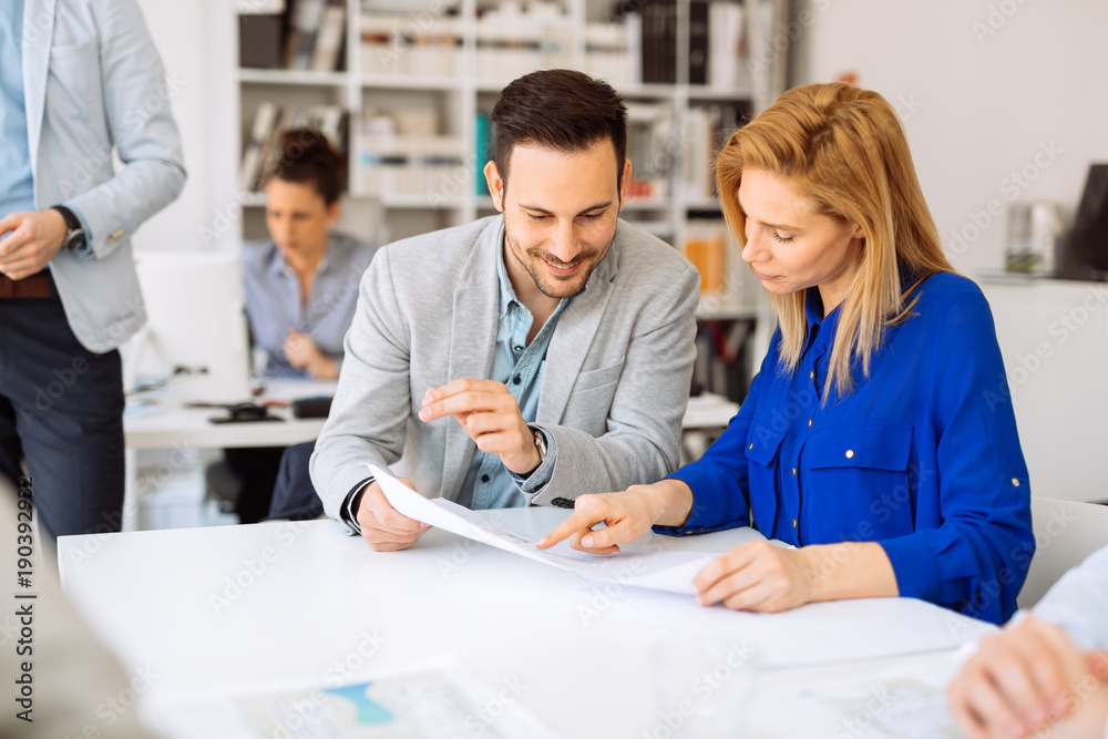 Businesspeople collaborating in office Businesspeople collaborating in office