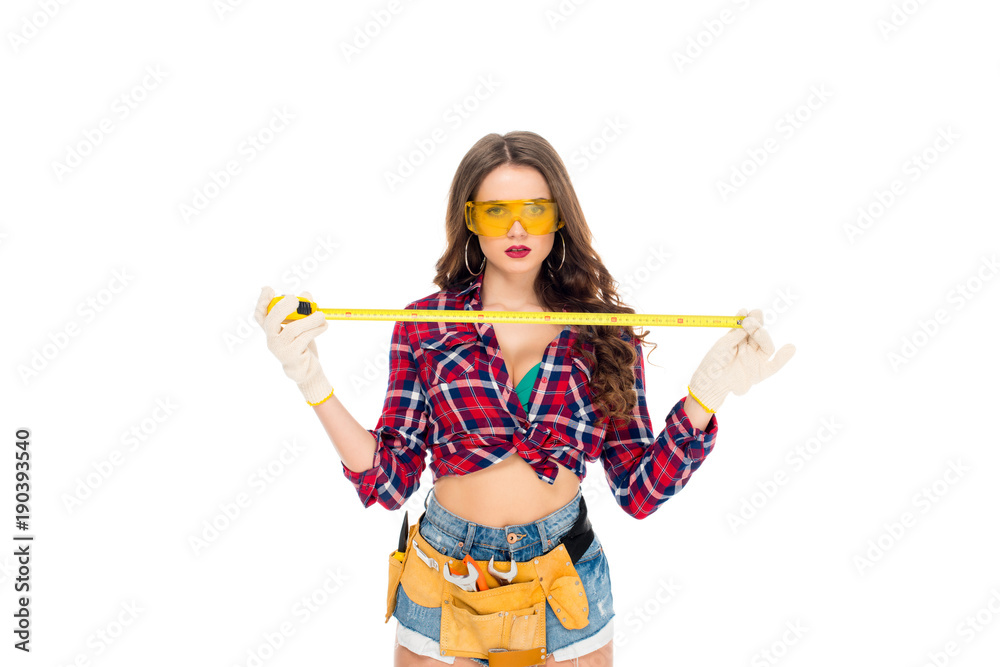 beautiful sexy girl in goggles posing with tape meaure, isolated on white beautiful sexy girl in goggles posing with tape meaure, isolated on white