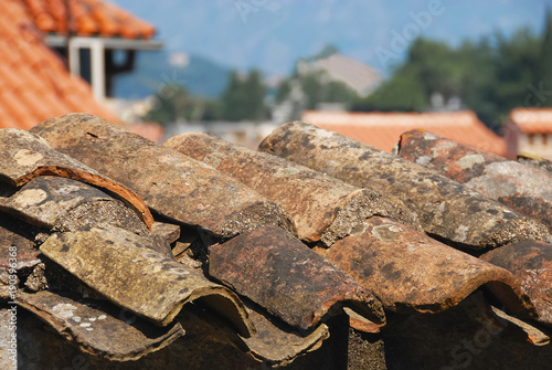  A piece of a rooftop with an old red tile pattern which is very common in mediterranean towns.