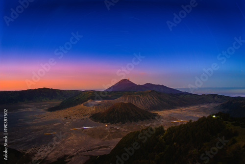 Mount Bromo volcano (Gunung Bromo) at sunrise with star trail in Bromo Tengger Semeru National Park, East Java, Indonesia.