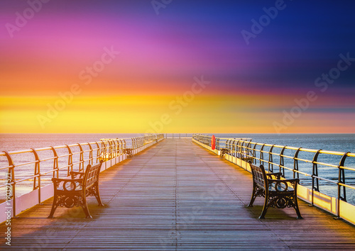 The wooden pier at sunset in Saltburn by the Sea, North Yorkshire, UK photo