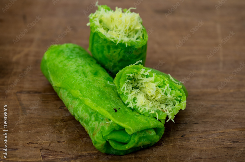Dadar Gulung / rolled pancake typical Indonesian coconut pancake centered. Dadar Gulung / rolled pancake typical Indonesian coconut pancake centered.