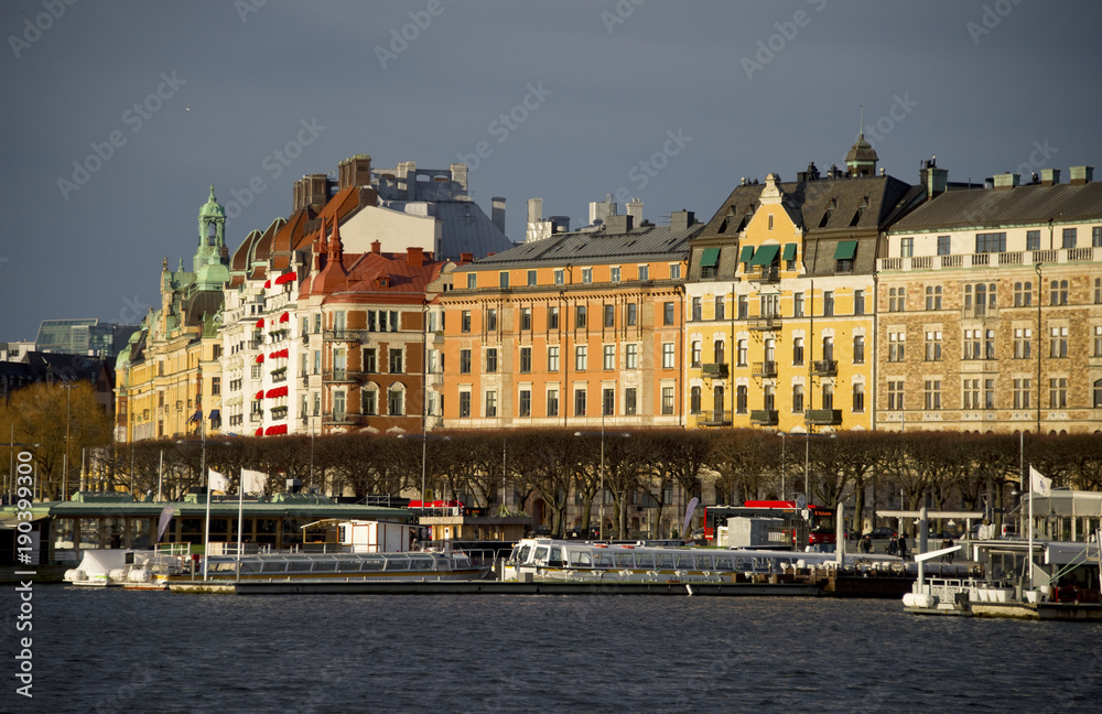 Houses at the pier of northern Stockholm in mid winter sun Houses at the pier of northern Stockholm in mid winter sun