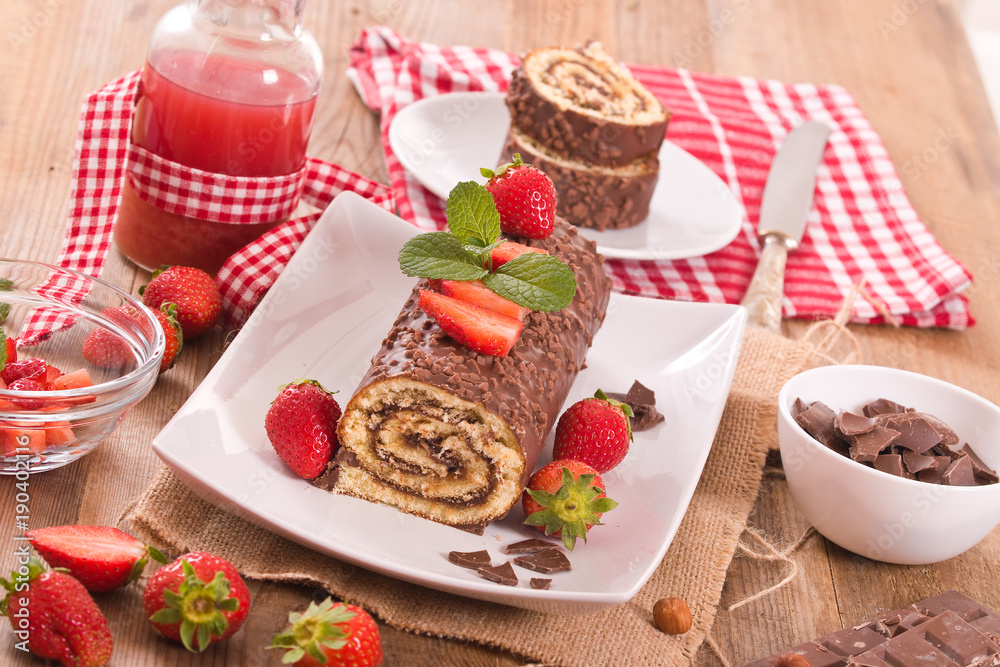 Chocolate roll with hazelnuts and strawberries. Chocolate roll with hazelnuts and strawberries.