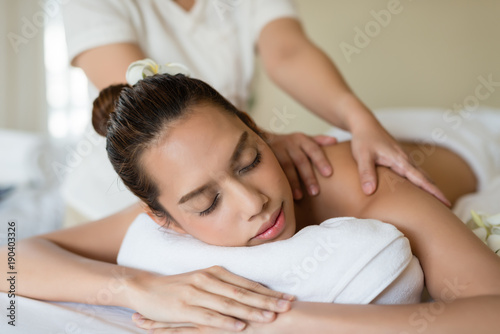 Young beautiful Asian woman relaxing in the spa massage
