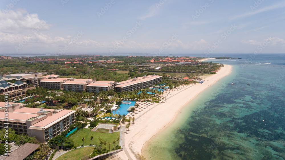 Aerial view of beautiful beach, hotels and tourists, Pura geger, Nusa Dua, Bali, Indonesia. Seascape, beach, ocean sea Travel concept