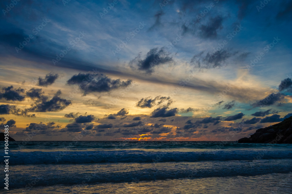 Fototapeta premium A beautiful sunset with a wall of clouds at Batok Bay on Ko Racha Yai. Racha Island is off the southeastern coast of Phuket, Thailand.