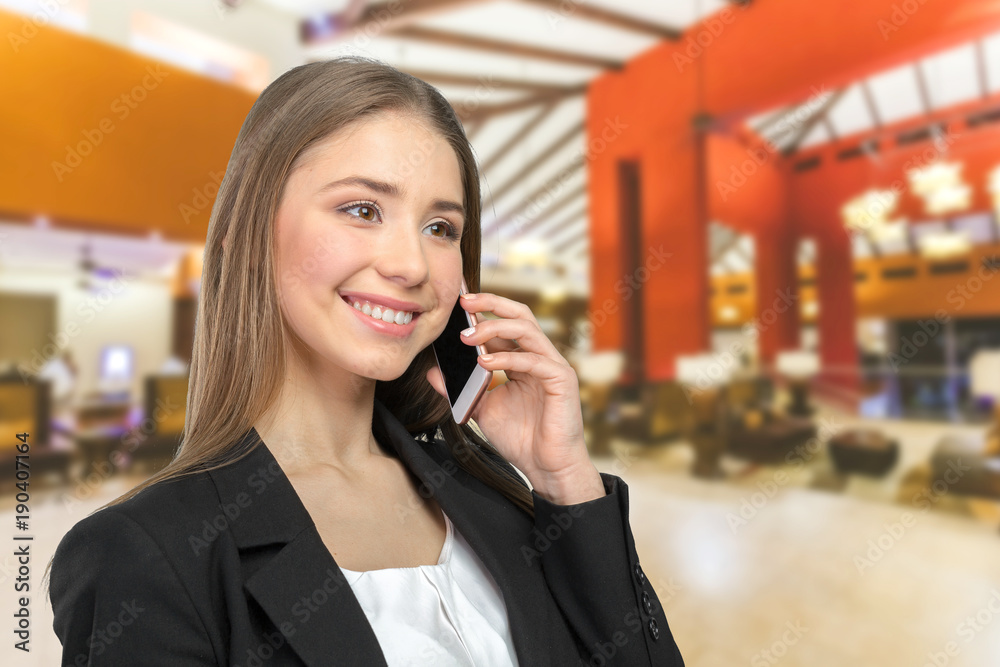 Young elegant woman talking on mobile phone Young elegant woman talking on mobile phone
