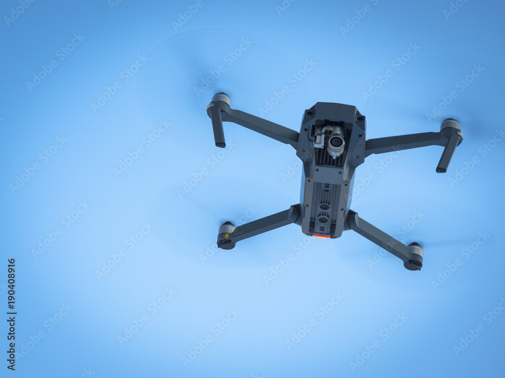 Drone flying in the blue sky, unmanned copter flight, Drone flying in the blue sky, unmanned copter flight,