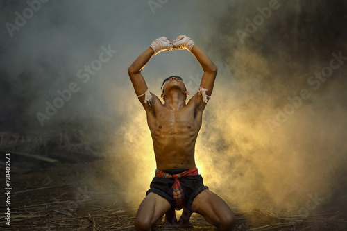 Muay thai, Thai Boxer training in sunset background,Thai boxer culture,Thailand photo