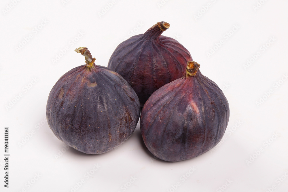 Fototapeta premium Fresh figs isolated on white background. Figs cut in half, in section