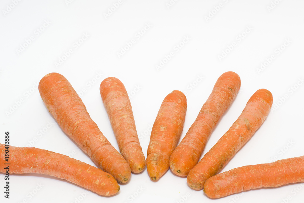 Carrots on a white background. Vegetables fresh orange. Vegetables in a group on a white background. Carrots on a white background. Vegetables fresh orange. Vegetables in a group on a white background.