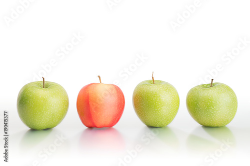 Four large fresh apples in the row isolated with clipping path