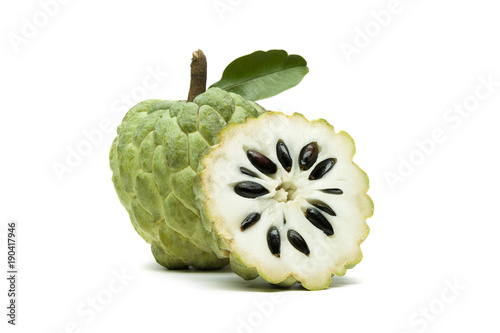 Custard apple or sugar apple with slice and green leaf isolated on white background, exotic tropical Thai annona or cherimoya fruit, healthy food 