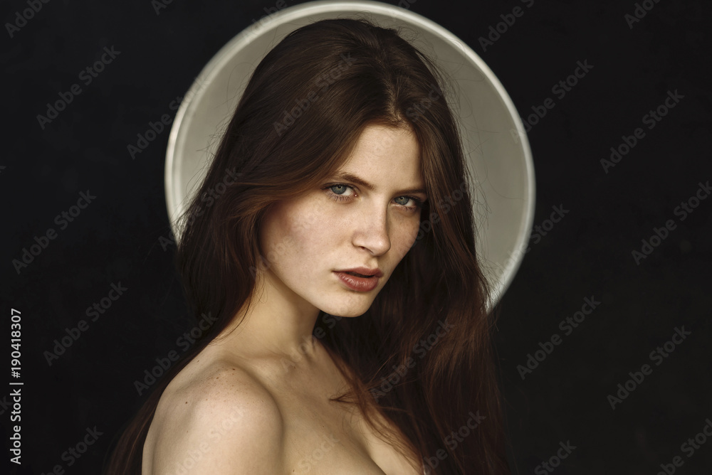 © Ivan Ozerov/Blend Images - Portrait of a young woman