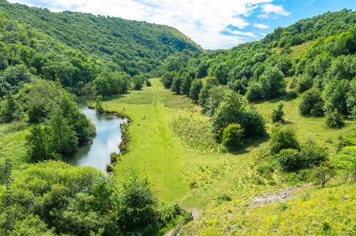 A scenic view of the Monsal Dale looking north-west along the River Wye in the v фототапет