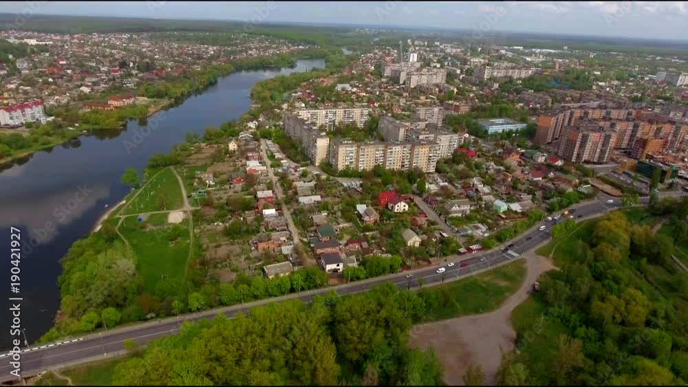 Aerial view of the cityscape with a buildings, river and reflection of clouds. Aerial view of the cityscape with a buildings, river and reflection of clouds.