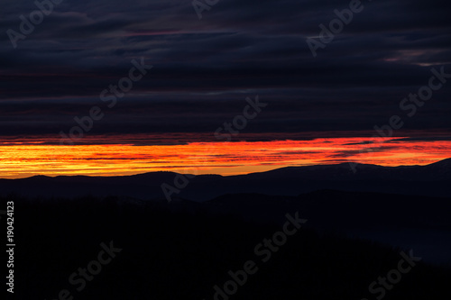 Glowing sky and dramatically colored clouds during sunset, view from Kopitoto Hill, Vitosha Mountain, Sofia, Bulgaria © Stanislava