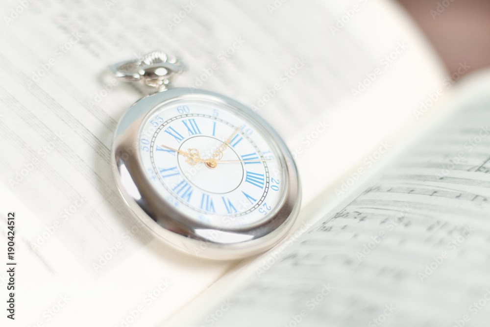 Old pocket watch with old books Old pocket watch with old books
