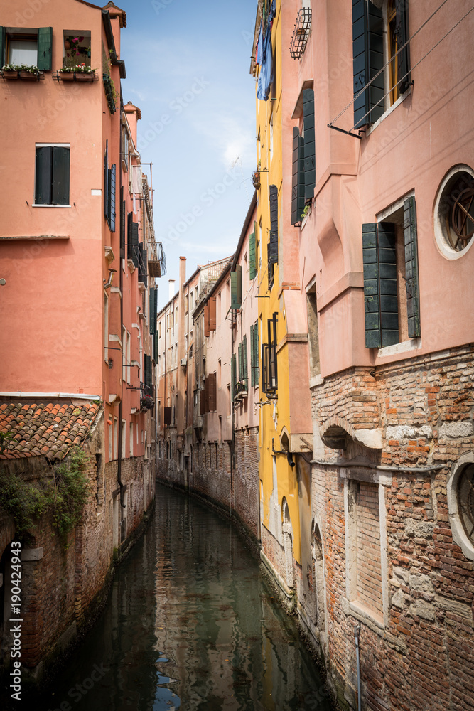 Venice in Italy / Small river canal and historical architecture