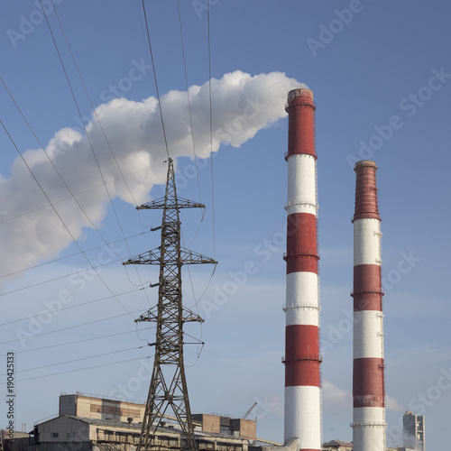smoke tube CHP against the blue sky