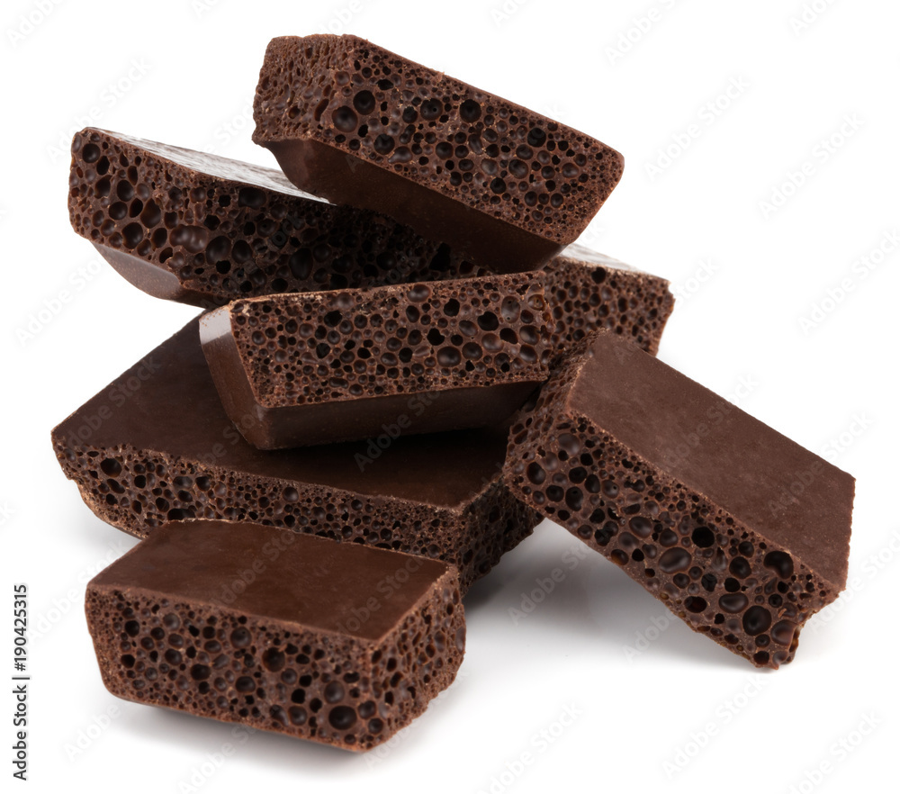 Dark porous chocolate isolated on white background Dark porous chocolate isolated on white background