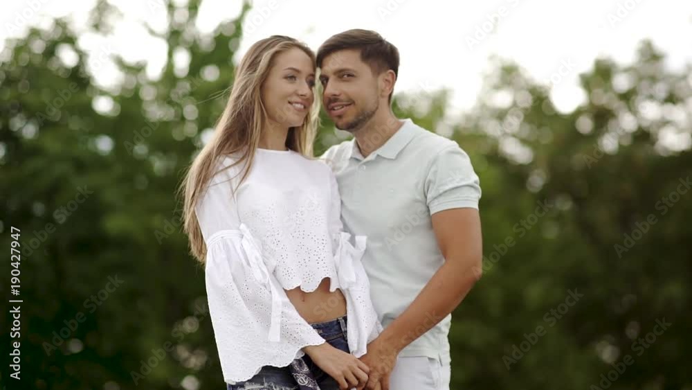 Couple Kissing. Romantic People In Love Kiss in Nature Couple Kissing. Romantic People In Love Kiss in Nature