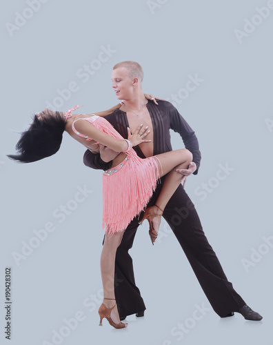 Beautiful ballroom couple performing their passionate exhibition