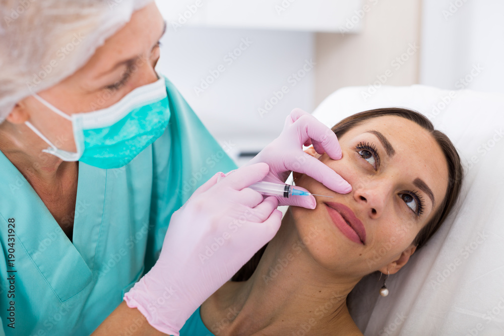Fototapeta premium Female receiving cosmetic injection