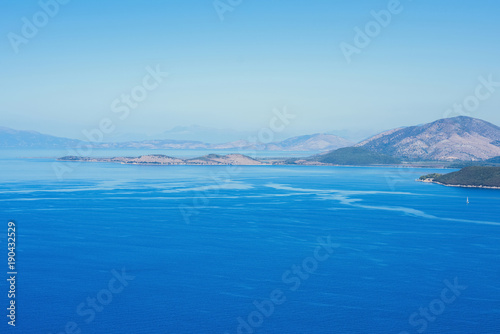 landscape of the Greek island of Kefalonia against the blue sky.