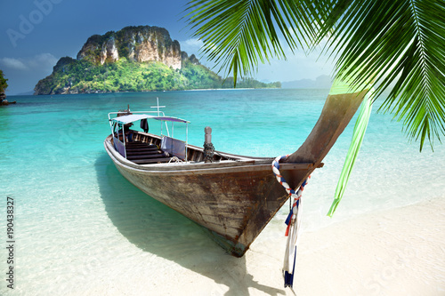 long boat on island in Thailand © Iakov Kalinin