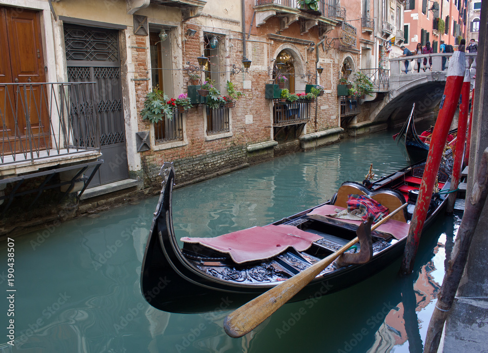 Venice, Italy-April 6, 2011-The antique gondola moored on a Venetian canal