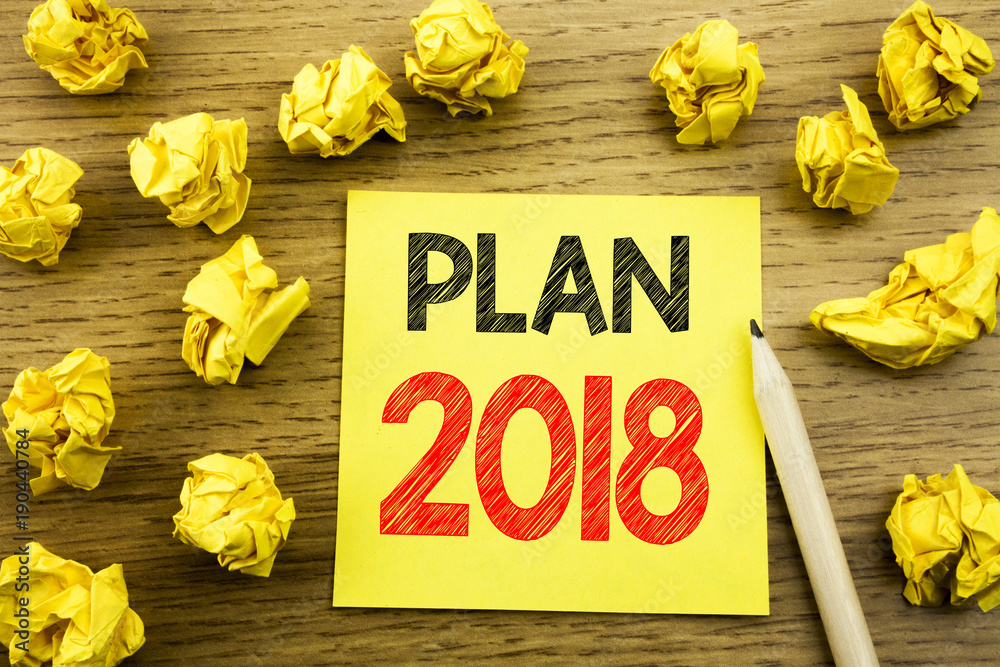 Fototapeta premium Word, writing Plan 2018. Business concept for Planning Strategy Action Plan written on sticky note paper on the wooden background. Folded yellow papers on the background