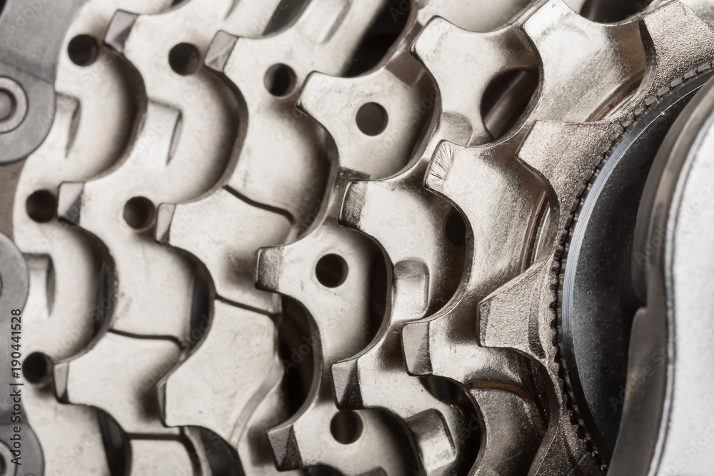 Obraz premium Close up of 9-speed cassette on rear wheel of bike, studio photo