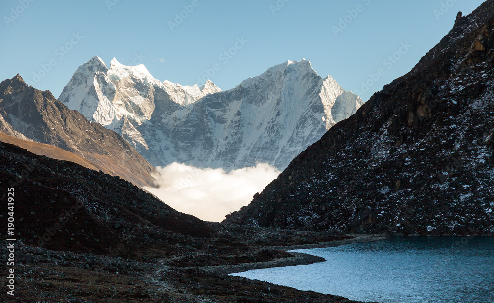 Himalayas. Gokyo Ri, Mountains of Nepal, snow covered high peaks and lake not far from Everest.