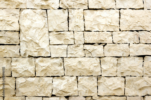 А wall made of unevenly hewn uneven stones