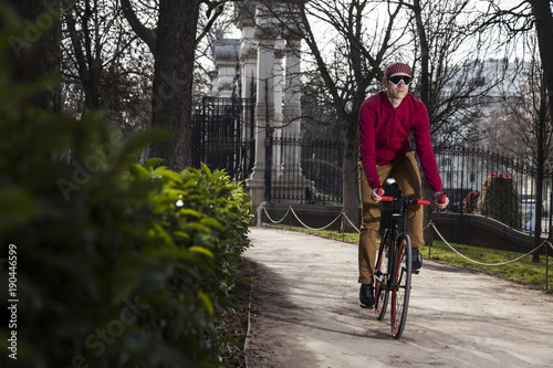 Wallpaper Mural cyclist ride on the park near the street Torontodigital.ca