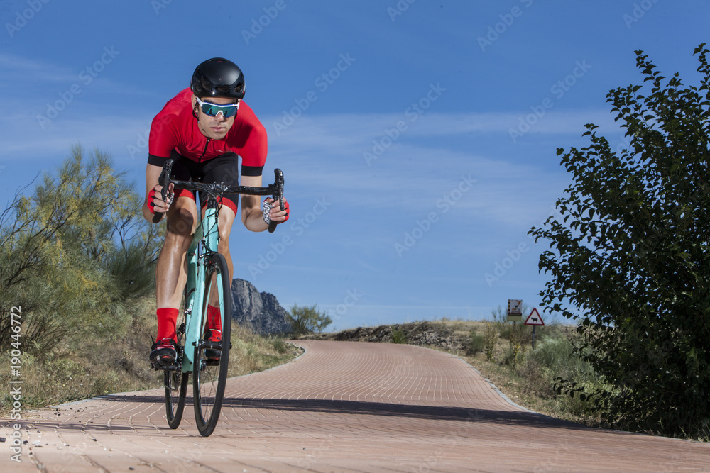 Fototapeta premium cyclist climbing the road 03