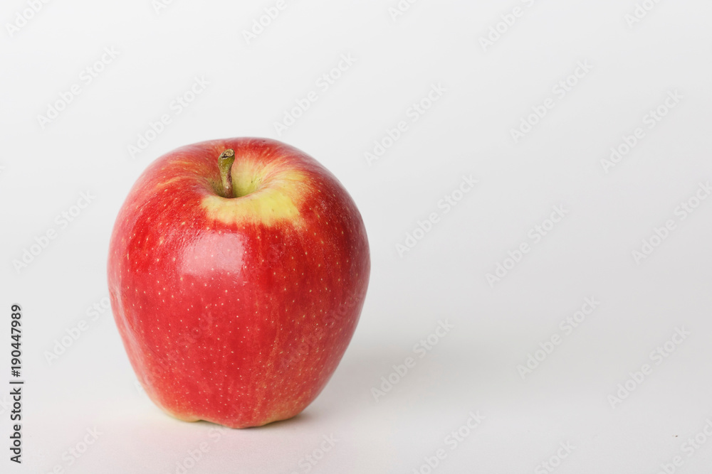 Red Shiny Apple for Snack on White Background with Room for Copy Red Shiny Apple for Snack on White Background with Room for Copy