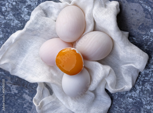 Duck Eggs and Yolk on Linen Cloth photo