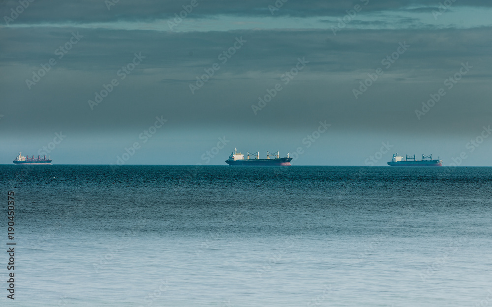 cargo conteiner ships sailing in still water