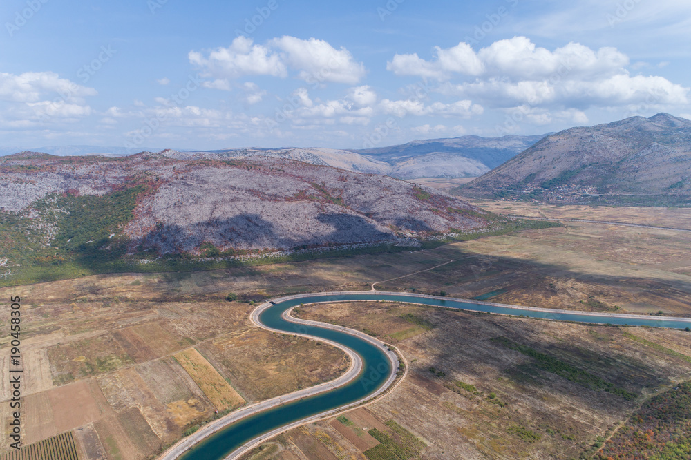 Aerial view to the valley and the Trebishnica river in the Bosnia and Hercegovina mountains.