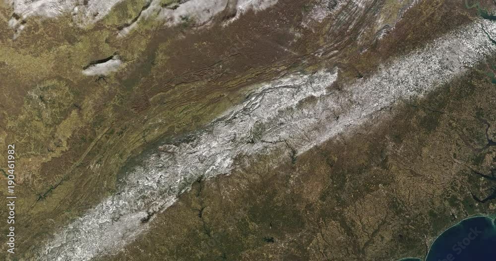 Slowly rotating zoom out from snow across the southeastern US, 2017. Reversible and can be rotated 180 degrees. Elements of this image furnished by USGS/NASA Landsat Slowly rotating zoom out from snow across the southeastern US, 2017. Reversible and can be rotated 180 degrees. Elements of this image furnished by USGS/NASA Landsat