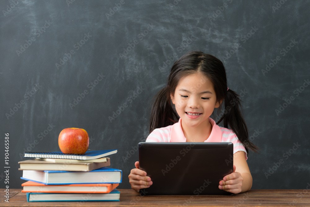 female kid children using mobile digital tablet female kid children using mobile digital tablet